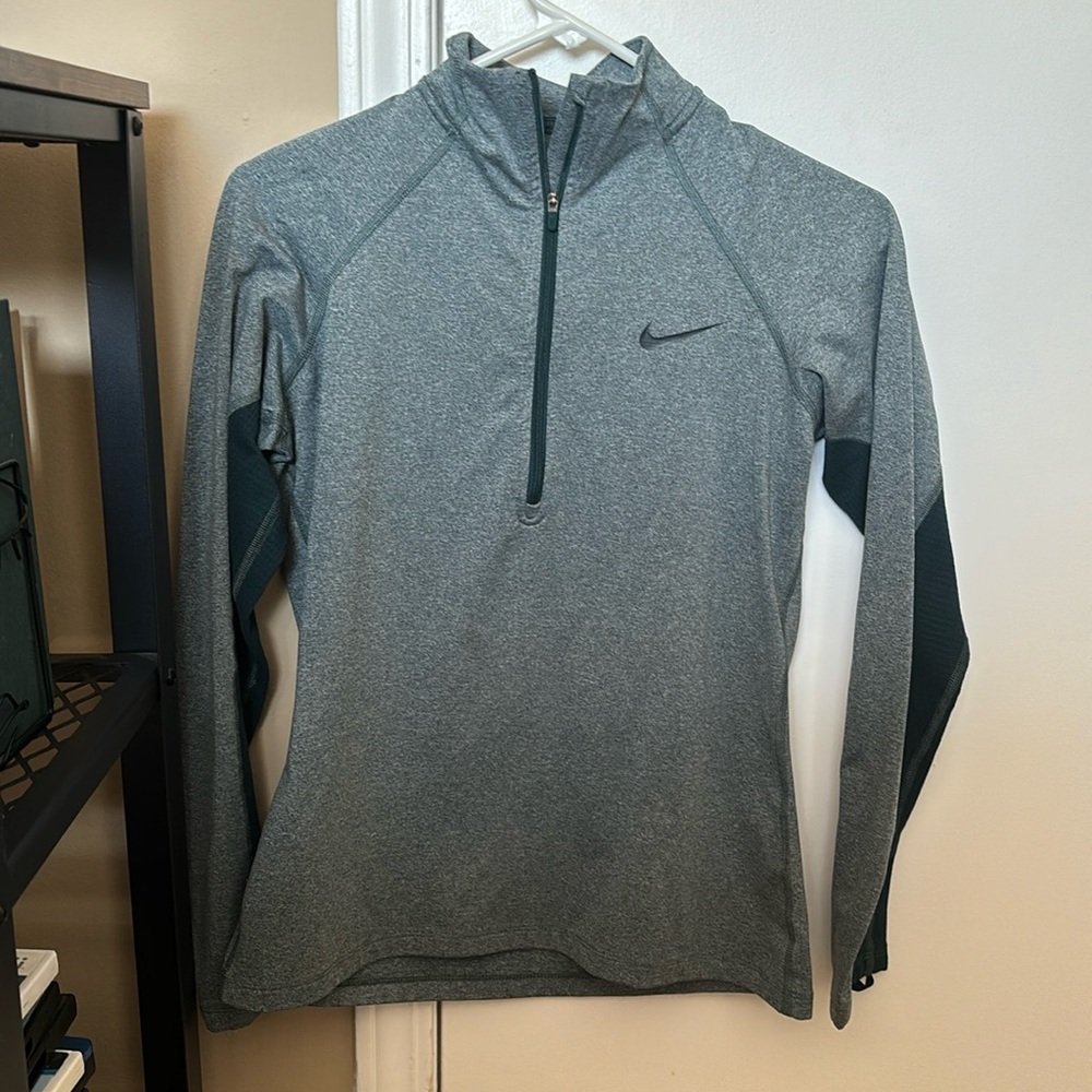 Turquoise Nike quarter zip.